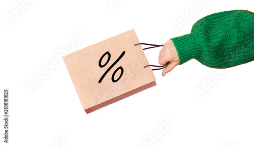 hand holding shopping bag with percent discount symbol isolated on transparent background, green sweater sleeve, promotional sale, seasonal shopping and special offer, retail, ecommerce, marketing