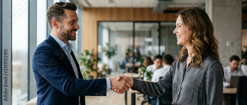 Business handshake: successful partnership in modern office, teamwork, agreement