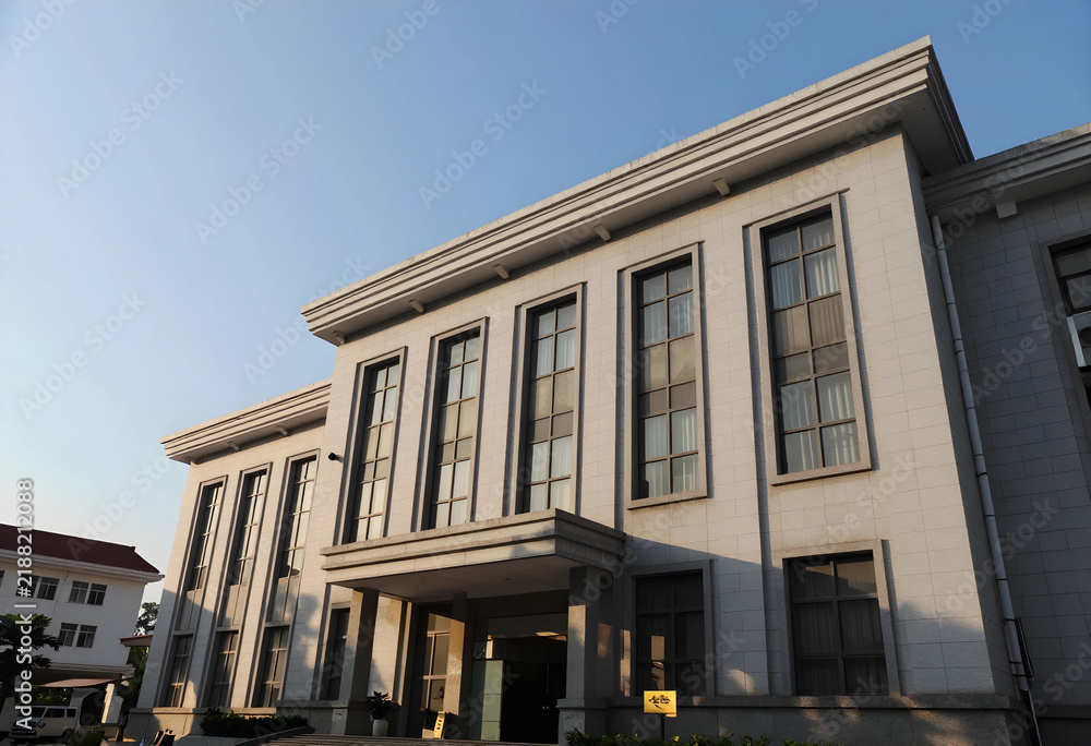 Obraz premium Institutional architecture and government building, public administration and civic infrastructure, classic stone facade with tall windows at sunset