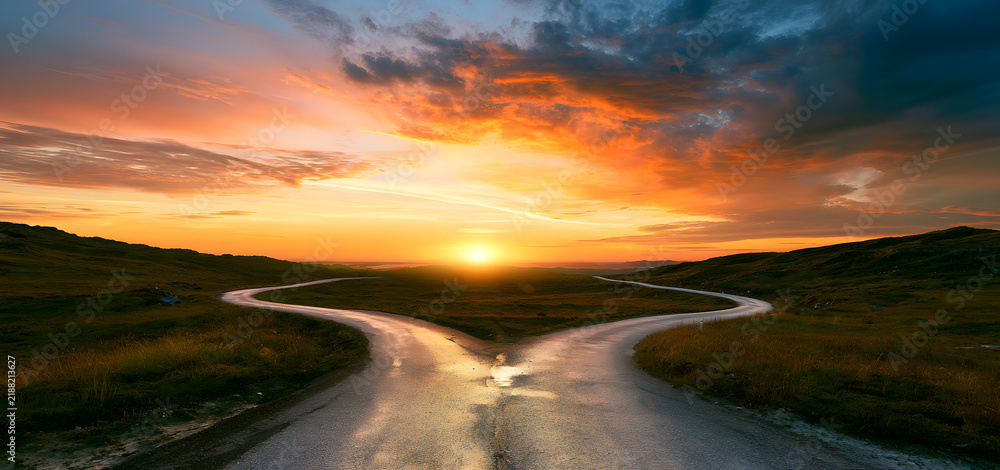 Obraz premium The sunset reveals two paths diverging prominently, serving as an allegory for choices and personal development.