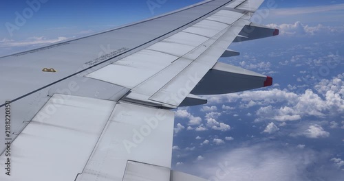 Airplane flying over the clouds in the air