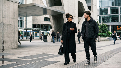Stylish couple walking confidently in modern urban city perfect for urban lifestyle concepts contemporary fashion editorials and luxury living