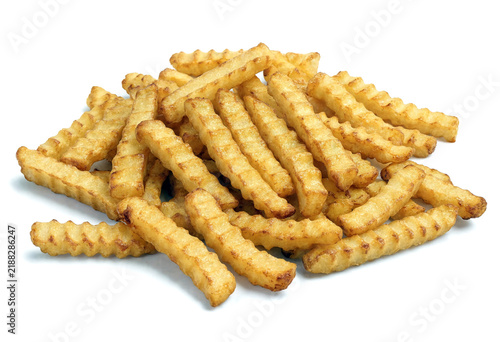 Crispy golden crinkle cut french fries pile ready to eat fast food snack isolated