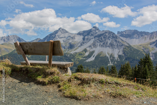 Bench with a view over a mountain range of the Swiss Alps, Arosa, Switzerland