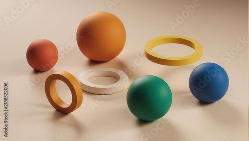 Colorful Spheres and Rings on Beige Surface - A Playful Arrangement.