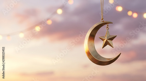 Golden crescent moon and star ornament hanging against sunset sky
