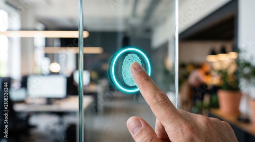 Fingerprint biometric scan on glass door, modern security system access control, identity verification technology, smart office building entrance, cyber protection safety