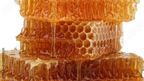 Photography Golden honeycomb dripping with sweet liquid, isolated on transparent background