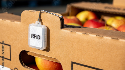 RFID tag attached to a box of apples that shows the role of technology in agriculture