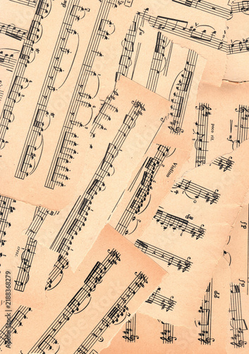 Background torn sheet music paper pieces. Full page. Vintage musical manuscript collage with paper texture. Ideal for scrapbooking, junk journals, printable designs, crafts and creative projects.