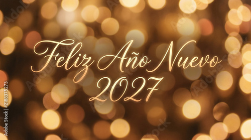 Golden festive background with new year 2027 greeting in spanish, feliz ano nuev