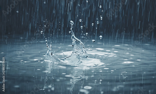 Falling rain splashes into a pool of water, creating a crown-shaped splash, suspended droplets, and expanding ripples against a dark blue-gray background. Background with copy space
