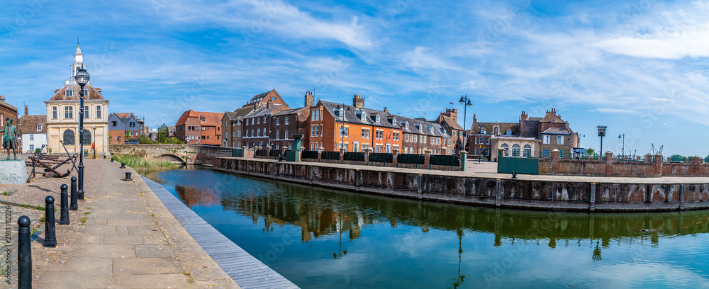 Fototapeta premium A panorama view along the quayside across Purfleet Quay in King's Lynn, Norfolk, England in summertime
