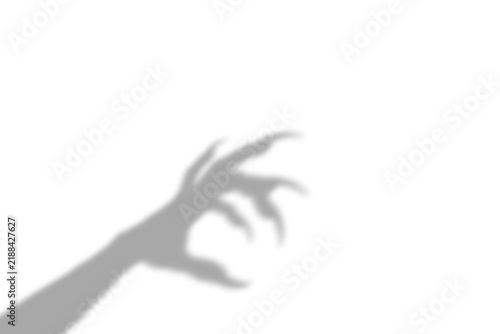 Canvas Print A creepy shadow of a long clawed monster hand reaching out from the corner of th