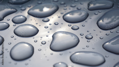 Canvastavla Water droplets on smooth gray surface forming abstract pattern, highlighting purity, freshness, surface tension and clean minimal background for hygiene, technology or design concepts