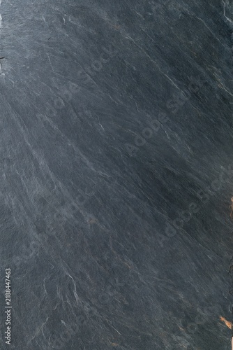 Dark slate stone texture with fine layered striation and subtle natural veining