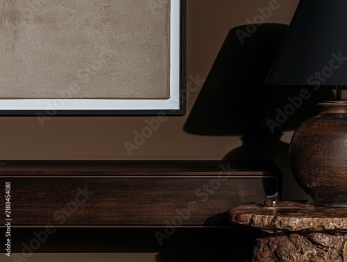 Dark wood sideboard with ceramic lamp and sculptural table in moody luxury interior