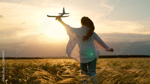 Konstfotografi Child playing with toy airplane