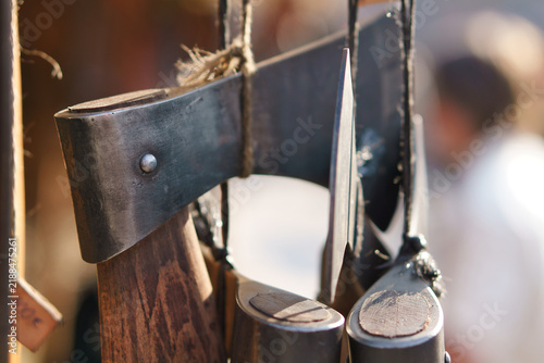 Foto Hand forged Axes Suspended on Cords at a Medieval Market.
