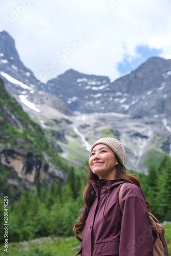 Vertical portrait image of a woman with mountain range in summertime, Chengdu, China