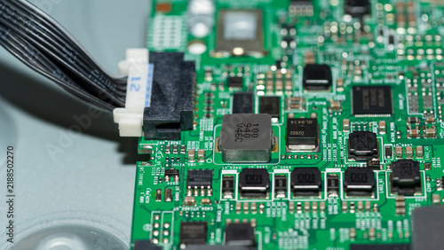 Obraz na płótnie Wire harness connector plugged into green circuit board with SMD components