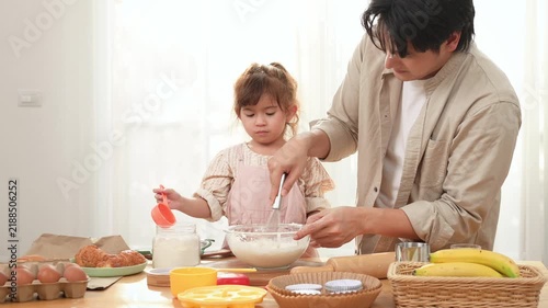 Family Enjoys Baking Together in a Bakery With a Girl Playing With Dough