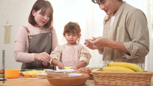 Family Enjoys Baking Together in a Bakery With a Girl Playing With Dough
