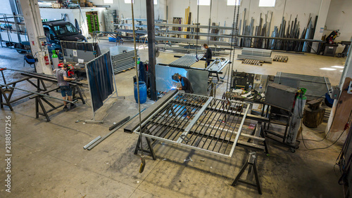 фотографія Metalwork workshop interior with steel frames resting on trestles