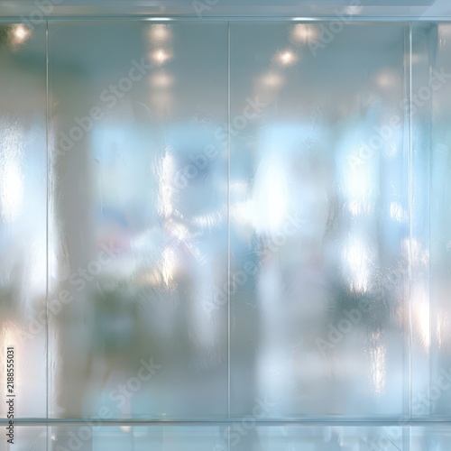 Frosted glass panels diffusing soft daylight through blurry outdoor