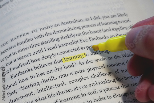 Learning word highlighted in a book page.