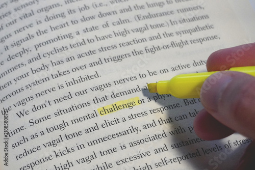 Challenge word highlighted in a book page.