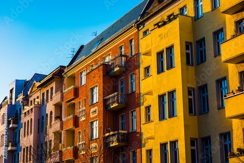 Colorful apartment buildings in bright sunlight
