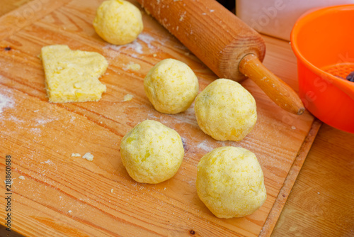 Preparing potato dough plum dumplings