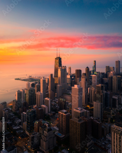 Aerial view of Chicago skyline glowing at sunrise