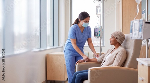Patient Receiving Chemotherapy Infusion In Bright Clinic With Nurse Support And Calm Care