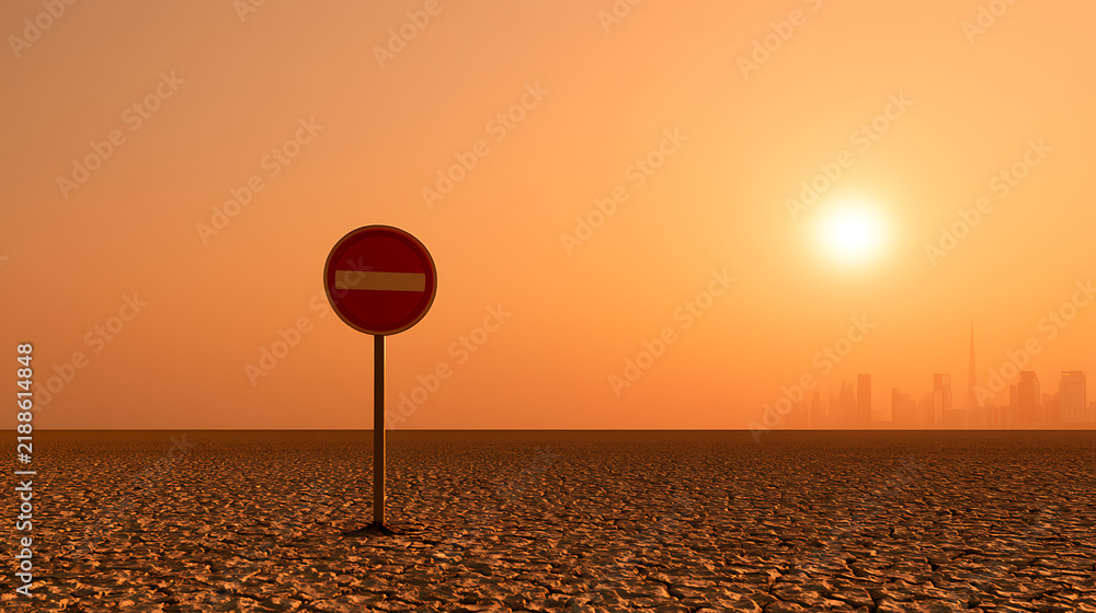 Obraz premium Red no entry sign stand alone in dry cracked earth desert landscape at sunset with city silhouette in background for concept illustration