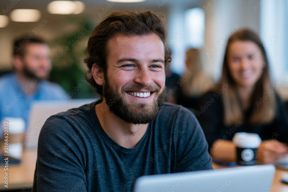 Obraz premium Startup founders discussing modern corporate business setting growth strategy in a bright coworking space, laptops and coffee cups, natural collaboration, no logos, no watermark, captured with