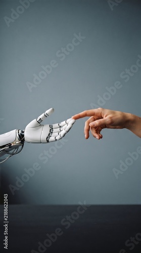 Human and Robotic Hands Reaching Toward Each Other Technology Concept
