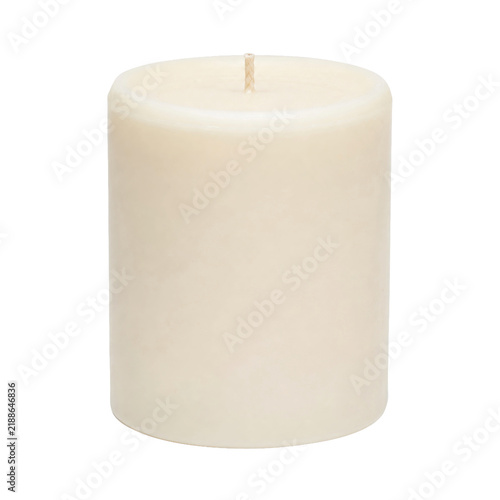 Фотография Single unlit cream-colored pillar candle with a visible wick stands upright, iso