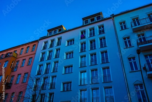 Obraz na płótnie Apartment buildings in front of a clear blue sky
