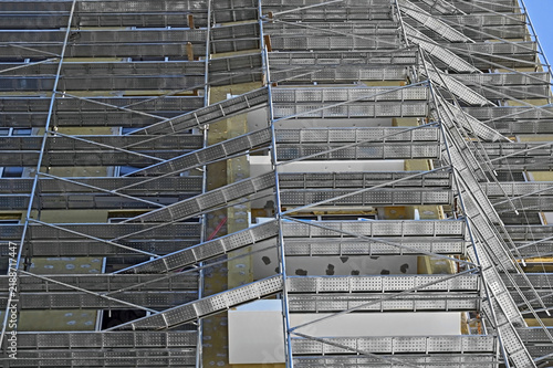 Cuadro en lienzo Construction site with scaffolding and thermal work