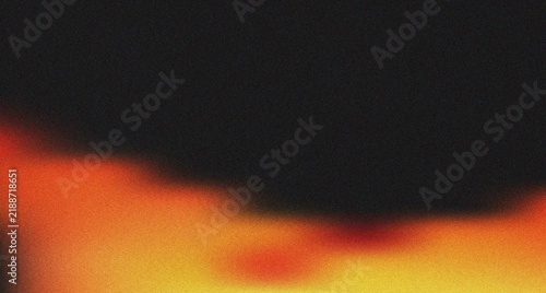 Abstract grainy overlay with soft luminous orange and red hues creating a dynamic visual design element