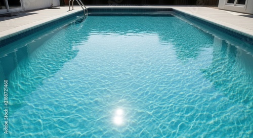 Serene Blue Swimming Pool Waters Gleaming Under Sunlight