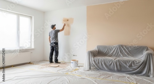 Professional Decorator Freshens Room With Fresh Coat Of Paint