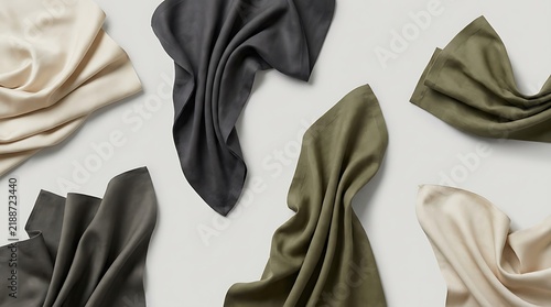 Collection of folded fabric napkins in different neutral and earthy colors