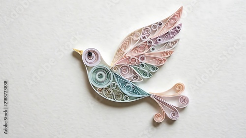 Colorful Paper Quilling Bird Craft on White Background