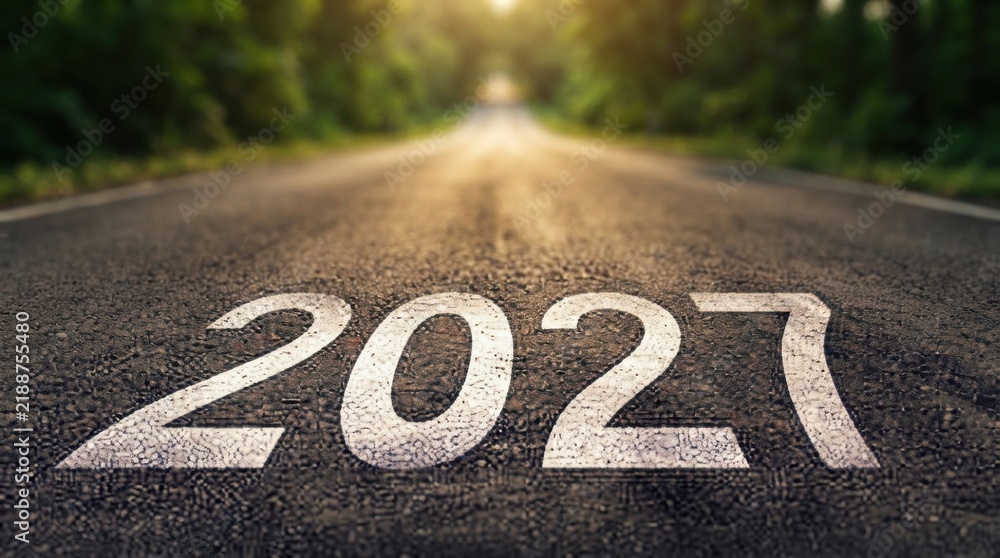 Obraz premium Happy New Year 2027 Road Sign on Asphalt Road with Bicycle Lane, Direction Arrow and Traffic Symbols for Urban Transportation, Cycling, Street Safety and Travel Navigation