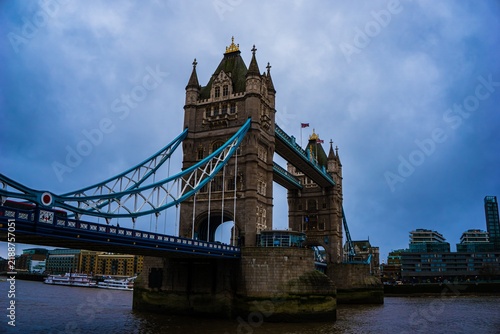 Canvas Print Iconic bridge towers against a dramatic cloudy sky