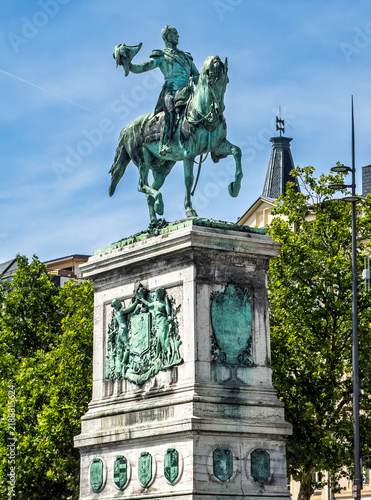 Luxembourg City, Luxembourg, Europe - July 24, 2026: Equestrian statue of William II, Grand Duke, in the square named after him. Green foliage and a blue sky