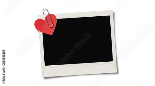 Blank photo frame with red heart and paper clip on white background